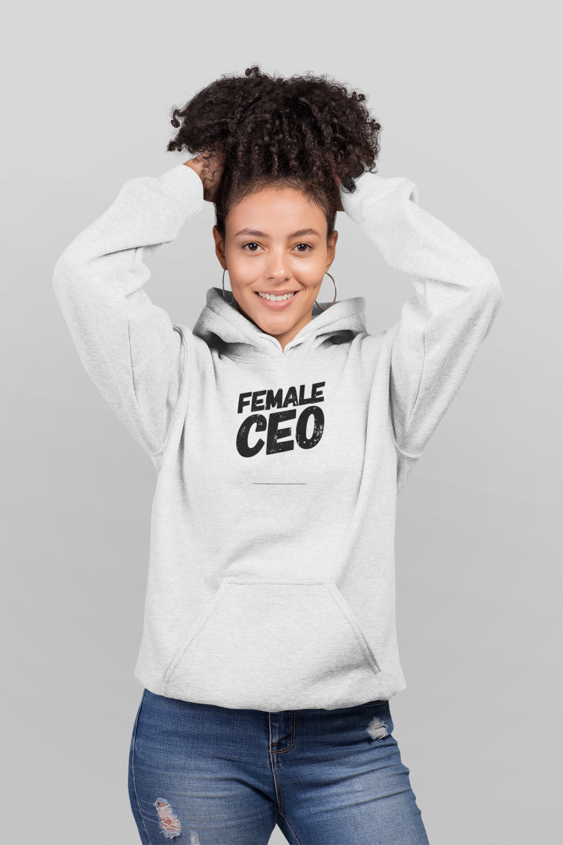 Female wearing a black hoodie with "Female CEO" text, branded by Scorpius, in a casual setting.