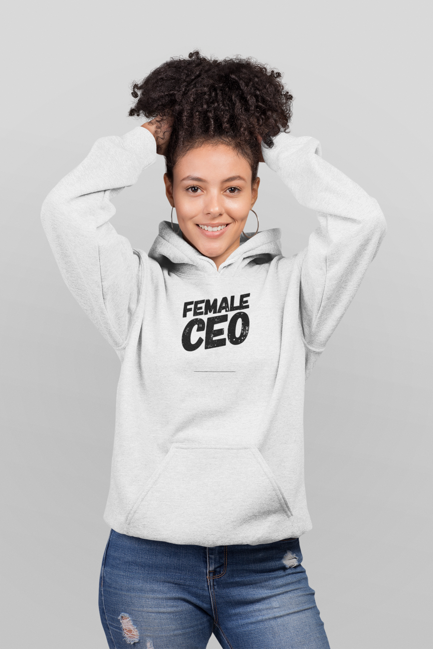 Female wearing a black hoodie with "Female CEO" text, branded by Scorpius, in a casual setting.