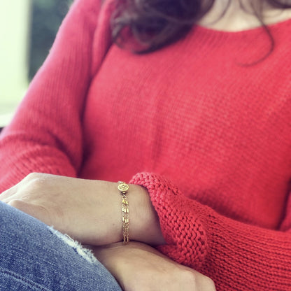 Orange Hermione Marilena bracelet featuring intricate gold filigree design by Cassiano Designs.