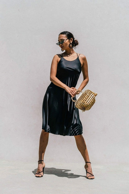 Black Florida minimal satin slip dress for women by Azure Thanatos, featuring smooth fabric and elegant, simple design.
