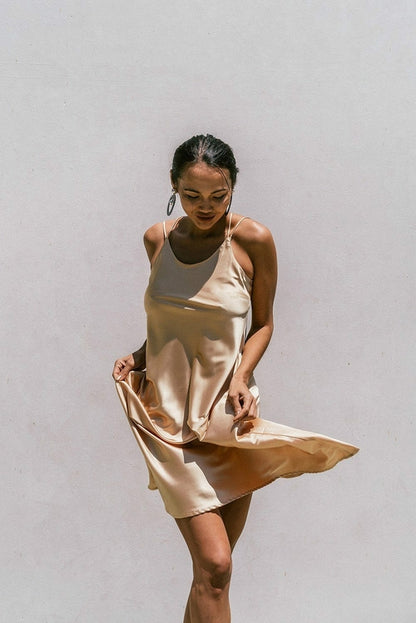 Light gold satin slip dress for women by Azure Thanatos, featuring a minimal Florida-inspired design and elegant fit.
