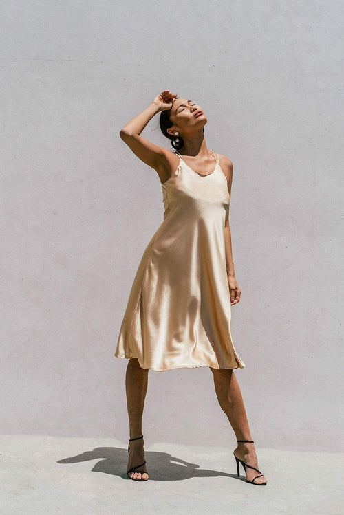 Light gold Florida minimal satin slip dress for women by Azure Thanatos, featuring a sleek, elegant design perfect for stylish occasions.
