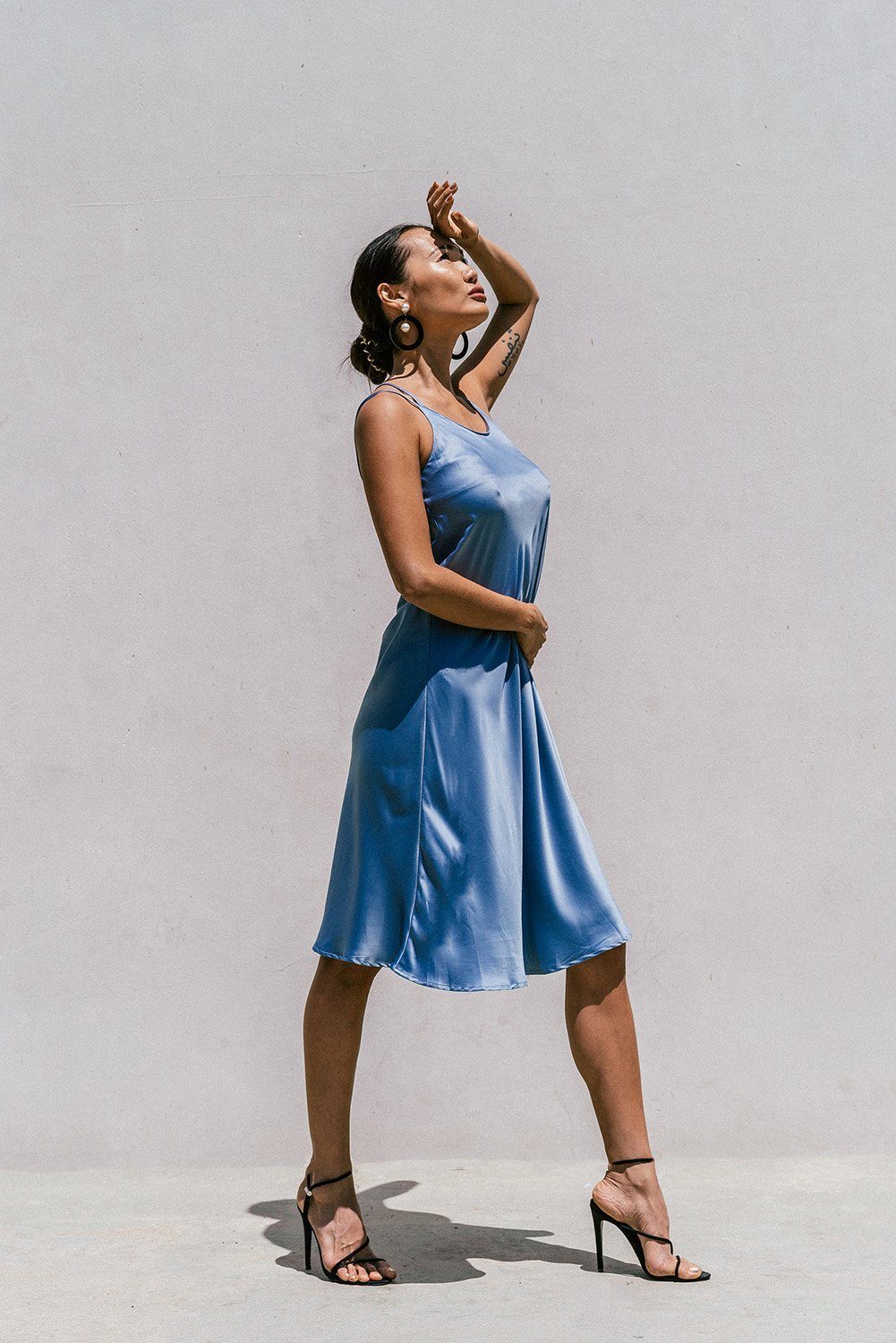 Azure Thanatos Florida minimal satin slip dress in smoky blue, showing the elegant, smooth fabric and sleek design for women&