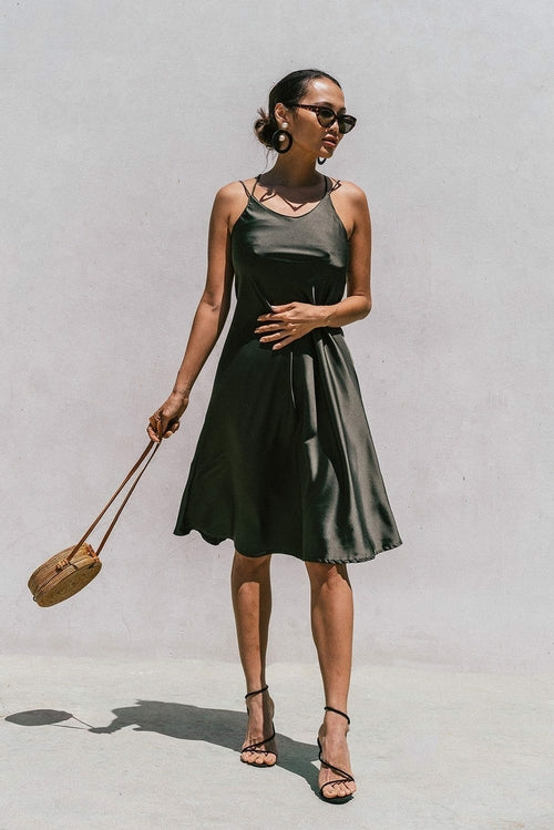 Olive green satin slip dress for women by Azure Thanatos, featuring a minimal, elegant design perfect for stylish occasions.