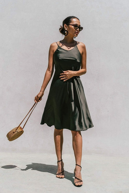 Olive green satin slip dress for women by Azure Thanatos, featuring a minimal, elegant design perfect for stylish occasions.