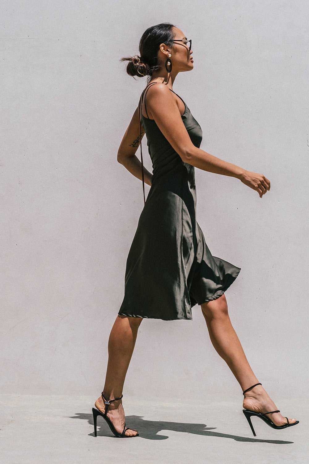 Olive green Florida minimal satin slip dress for women by Azure Thanatos, featuring a sleek, smooth fabric and minimalist design.