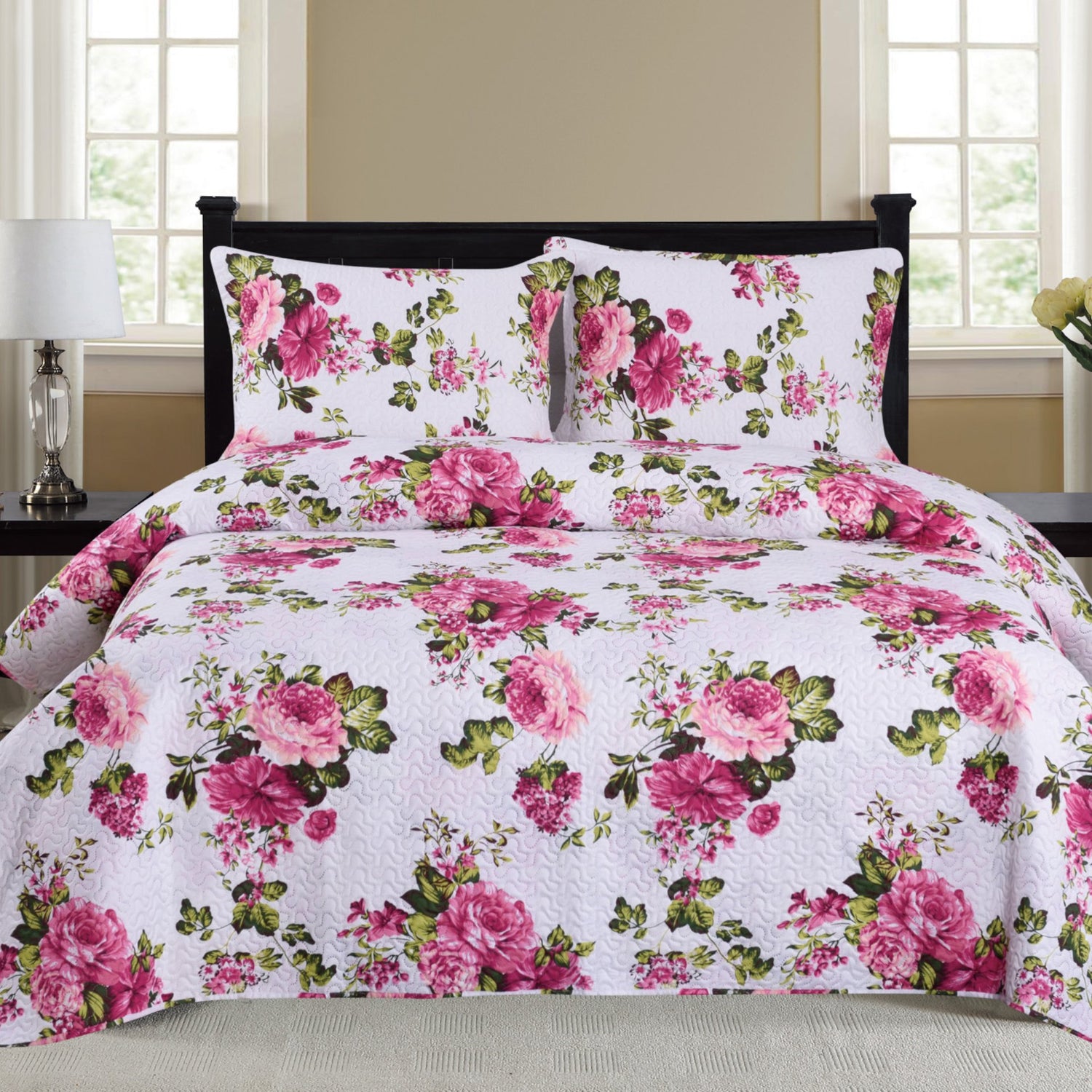 Azure Zeus Cynthia 3-piece quilt set in vibrant fuchsia with matching pillow shams on a bed.