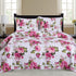 Azure Zeus Cynthia 3-piece quilt set in vibrant fuchsia with matching pillow shams on a bed.
