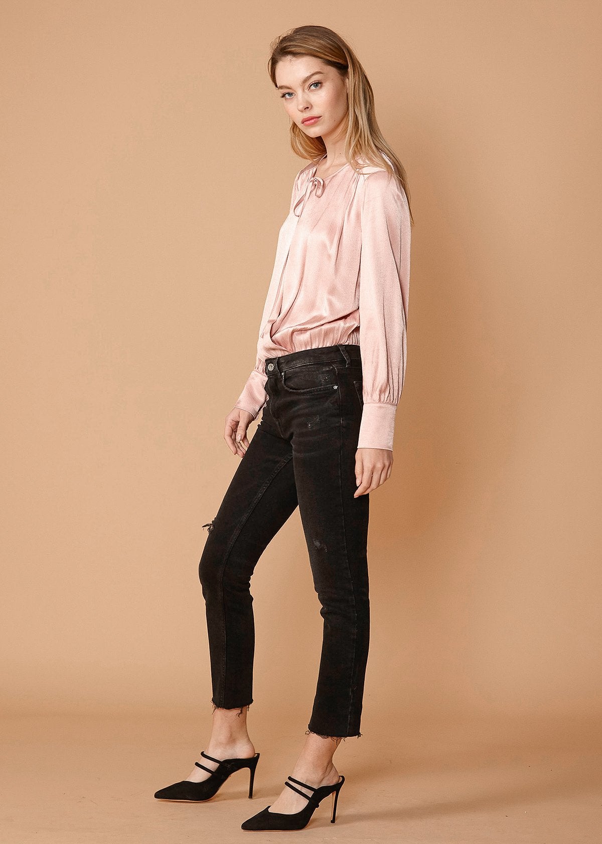 Lemon Hera tie-neck long sleeve bodysuit in fall pink, close-up of fabric and stylish design on model.