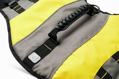 Yellow dog life vest by Beige Antigone with adjustable straps and handle for swimming safety and outdoor water activities.