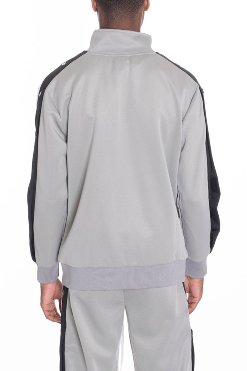Grey Lime Milo snap button track jacket with a sporty design, featuring front snap buttons and a casual fit.