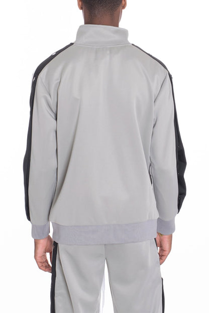 Grey Lime Milo snap button track jacket with a sporty design, featuring front snap buttons and a casual fit.