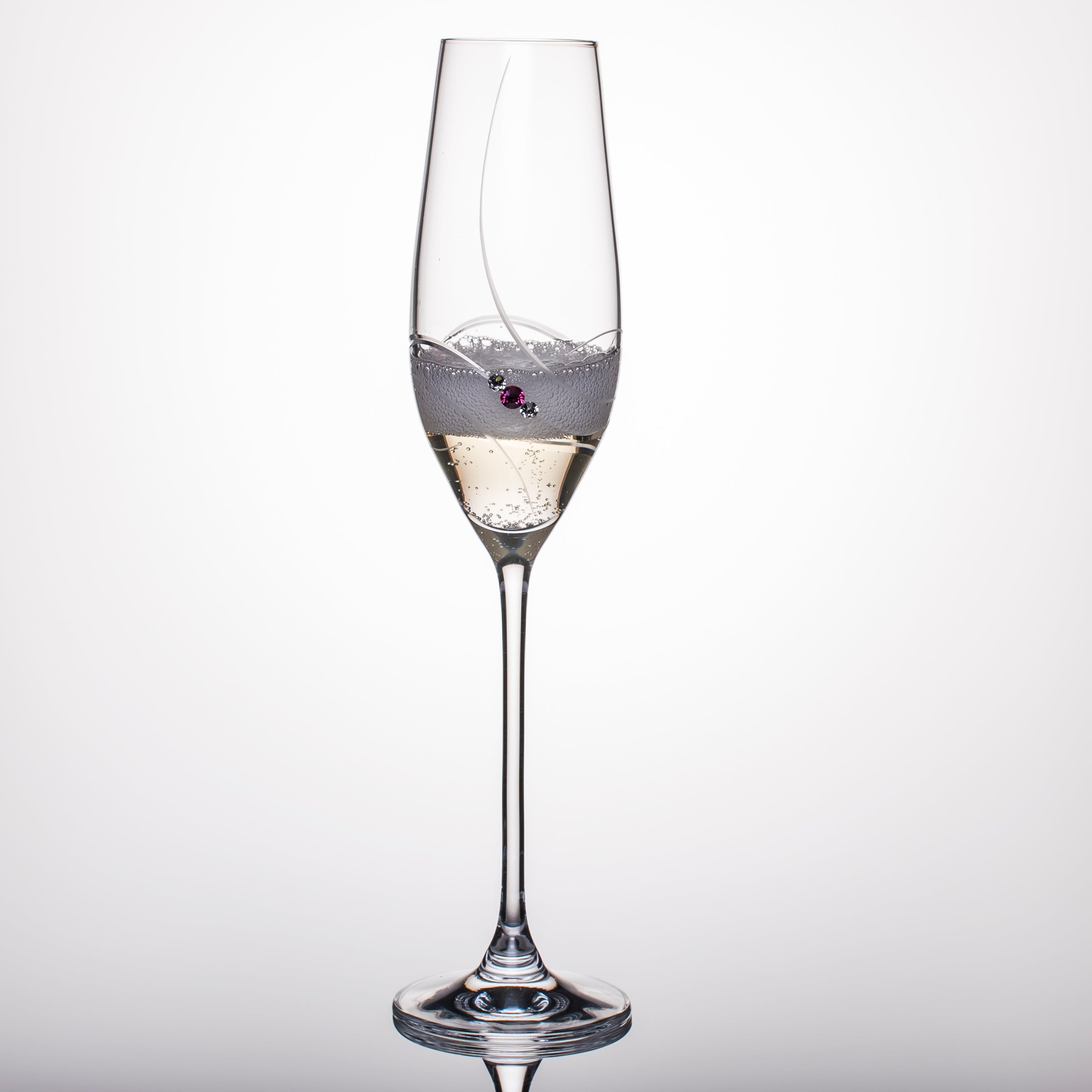 Crimson Shadow pink ribbon champagne glass in a gift box, elegant drinkware for celebrations, close-up of one glass showing pink ribbon design.