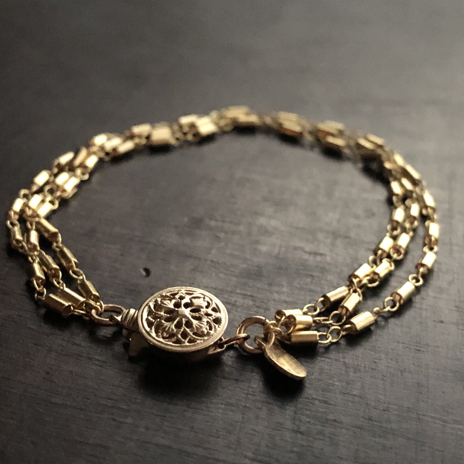 Gold fill filigree bracelet from Cassiano Designs, featuring intricate craftsmanship and elegant design by Orange Hermione.