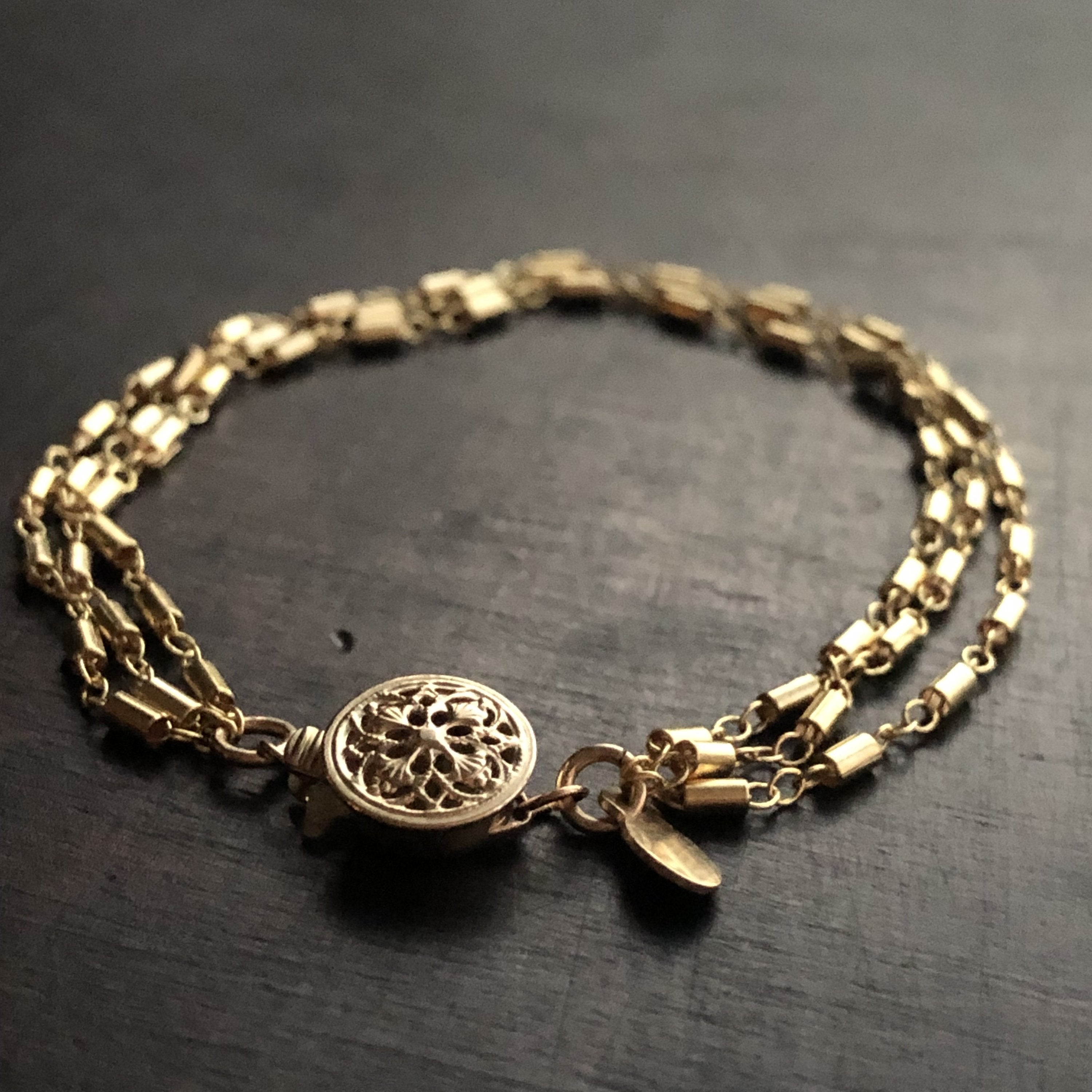 Gold fill filigree bracelet from Cassiano Designs, featuring intricate craftsmanship and elegant design by Orange Hermione.