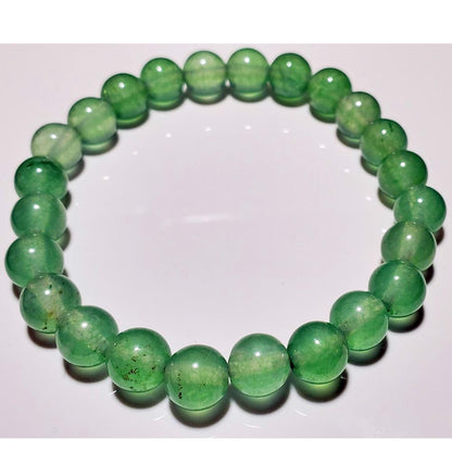Green aventurine beaded elastic stretch bracelet by Silver Hestia, featuring smooth round beads in a flexible jewelry design.