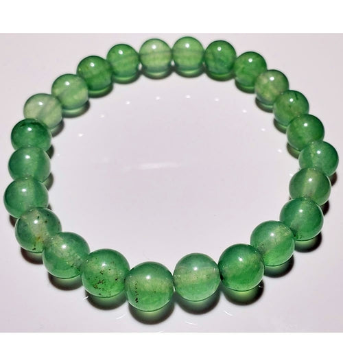 Green aventurine beaded elastic stretch bracelet by Silver Hestia, featuring polished round beads on a flexible band.