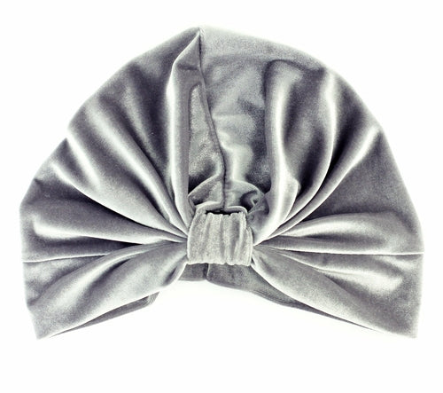 Grey stretch velvet turban by Cyan Ismene, soft and stylish haircare accessory, shown on a plain background.