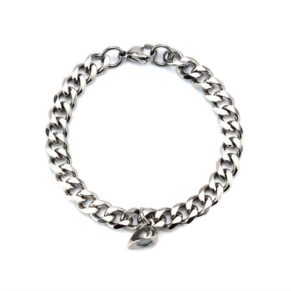 Silver Juneberry stainless steel couple bracelets with magnetism heart charms and Cuba chain design.