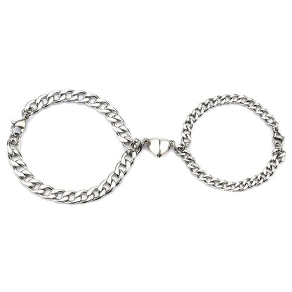 Silver Juneberry stainless steel couple bracelets with magnetism heart charms and Cuba chain design, perfect for romantic matching jewelry.
