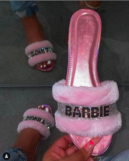 Pink faux fur slides by Silver Juneberry, stylish footwear with soft fur lining and open-toe design for casual comfort.