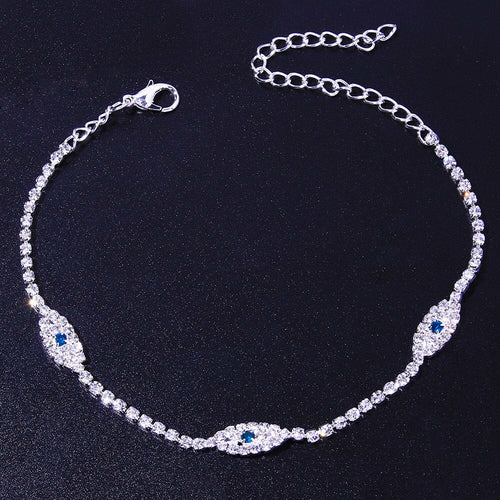 Vintage blue evil eye anklet bracelet by Red Iphigenia featuring crystal accents, perfect for beachwear and summer style.