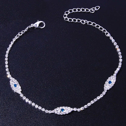 Vintage blue evil eye anklet bracelet by Red Iphigenia featuring crystal accents, perfect for beachwear and summer style.