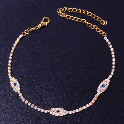 Vintage blue evil eye anklet bracelet for women with crystal accents, featuring beach-inspired design by Red Iphigenia.