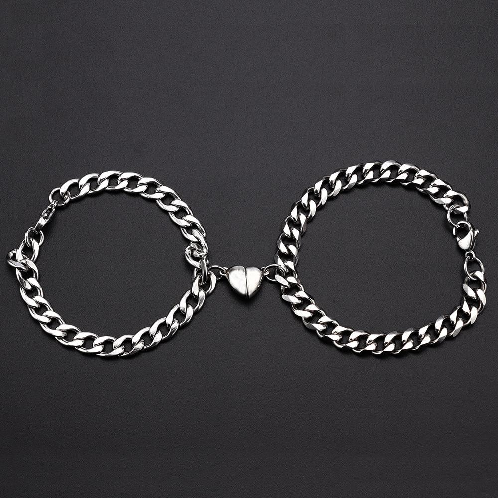 Silver Juneberry stainless steel couple bracelets with magnetism and heart charms on Cuba chain, stylish and durable jewelry for couples.