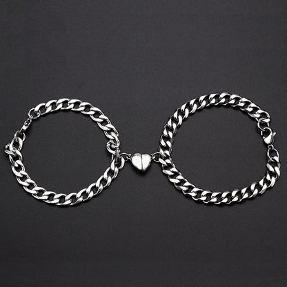 Silver Juneberry stainless steel couple bracelets with magnetism and heart charms on Cuba chain, stylish and durable jewelry for couples.