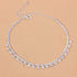 Red Iphigenia barefoot chain bracelet worn on the leg, featuring delicate jewelry design for beach accessories or gift ideas.