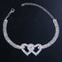 Red Iphigenia double heart anklet bracelet for women, beach jewelry with adjustable chain and heart charms on ankle.