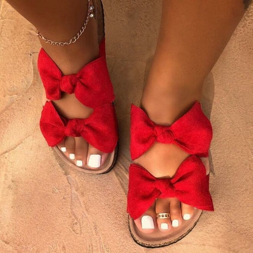 Red women’s Silver Juneberry slide sandals with two straps and a bow, designed for comfort and casual wear.