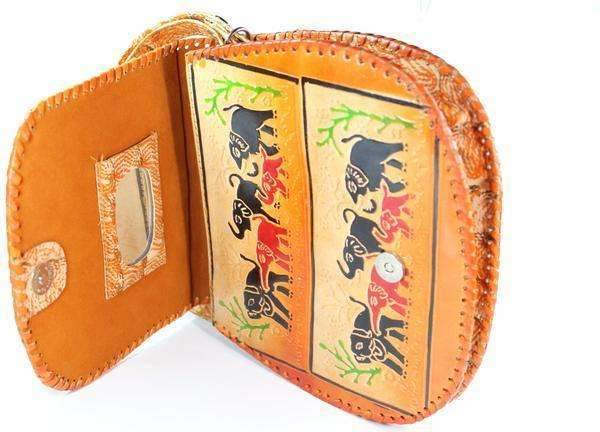 Silver Hestia herd of elephants purse fanny pack featuring a colorful elephant design on a black background.
