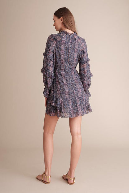 Colorful Kenzie wrap front mini dress by Viridian Smokey featuring a violet and navy multicolor design, displayed on a hanger.