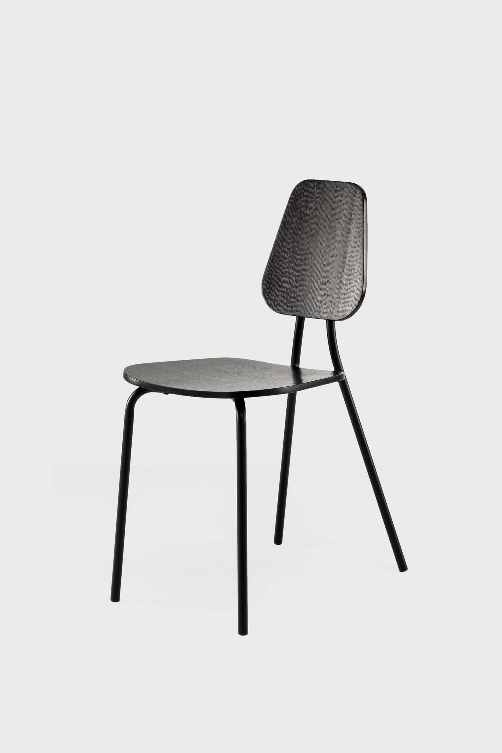 Black Hoya Oak chair by Aquamarine Poppy, featuring modern wooden furniture design with a sleek, polished finish.