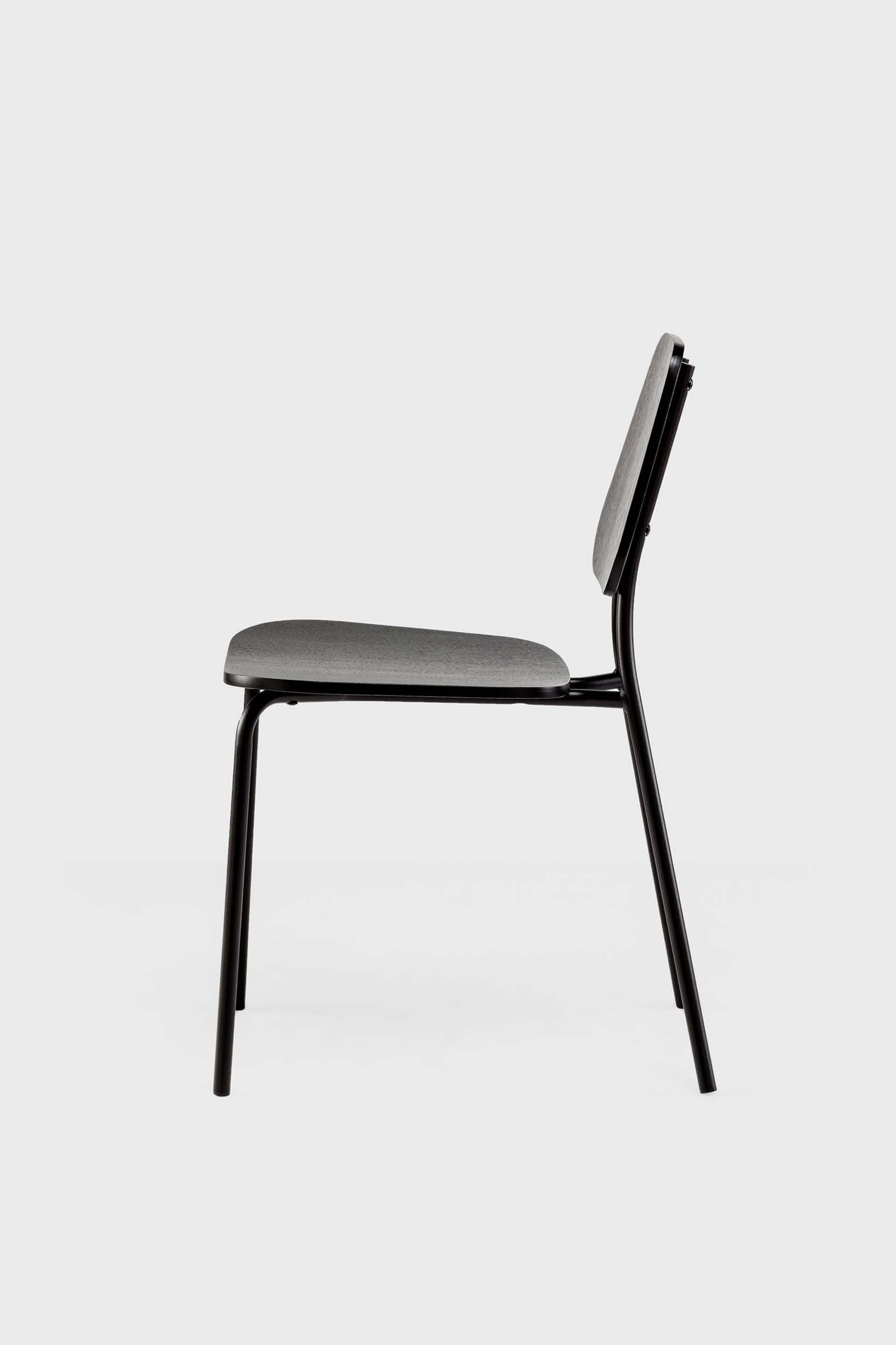 Aquamarine Poppy Hoya black oak chair showing sleek black wooden frame and modern furniture design.