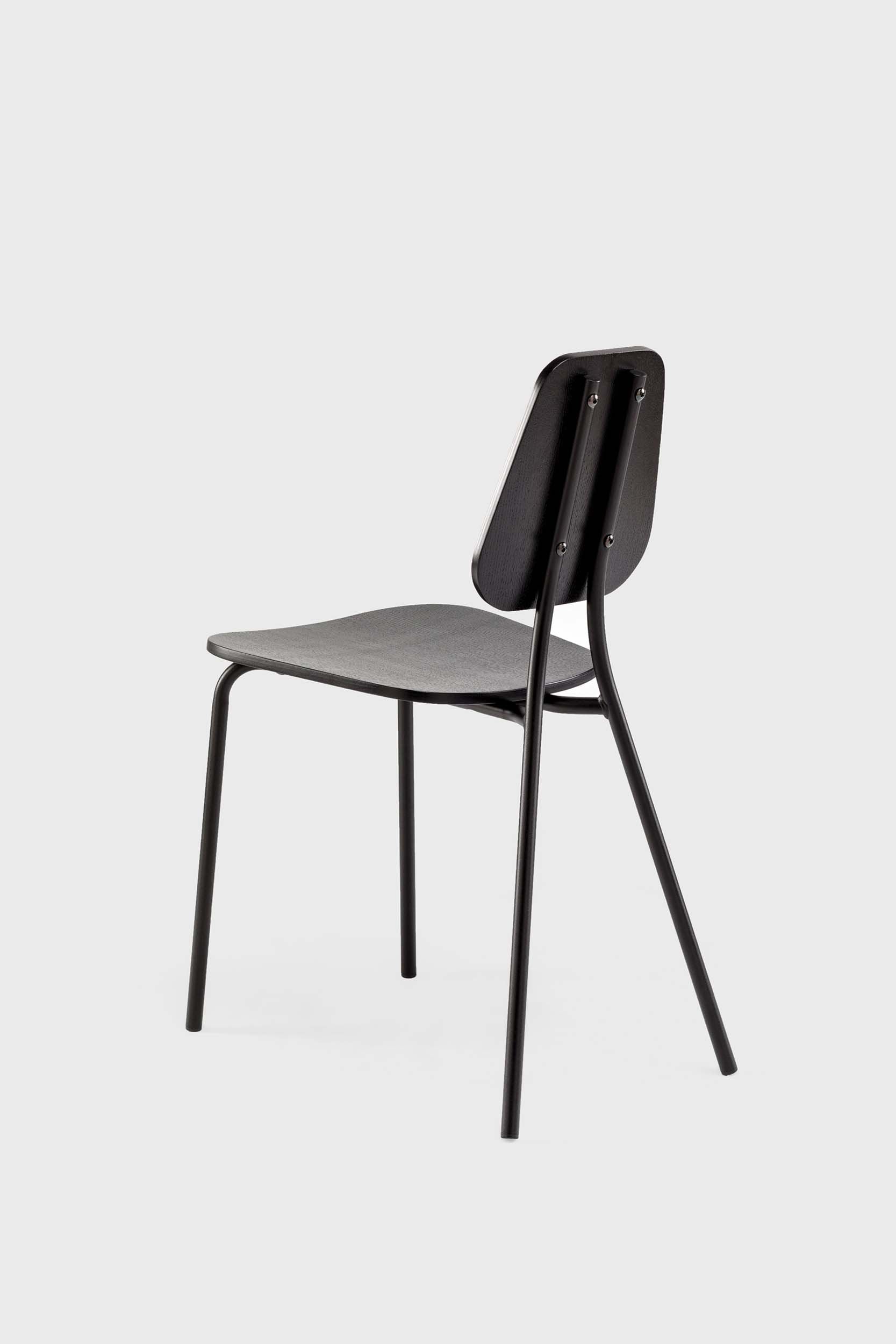 Black Hoya oak chair by Aquamarine Poppy, featuring a modern furniture design with a sleek wooden frame and comfortable seating.