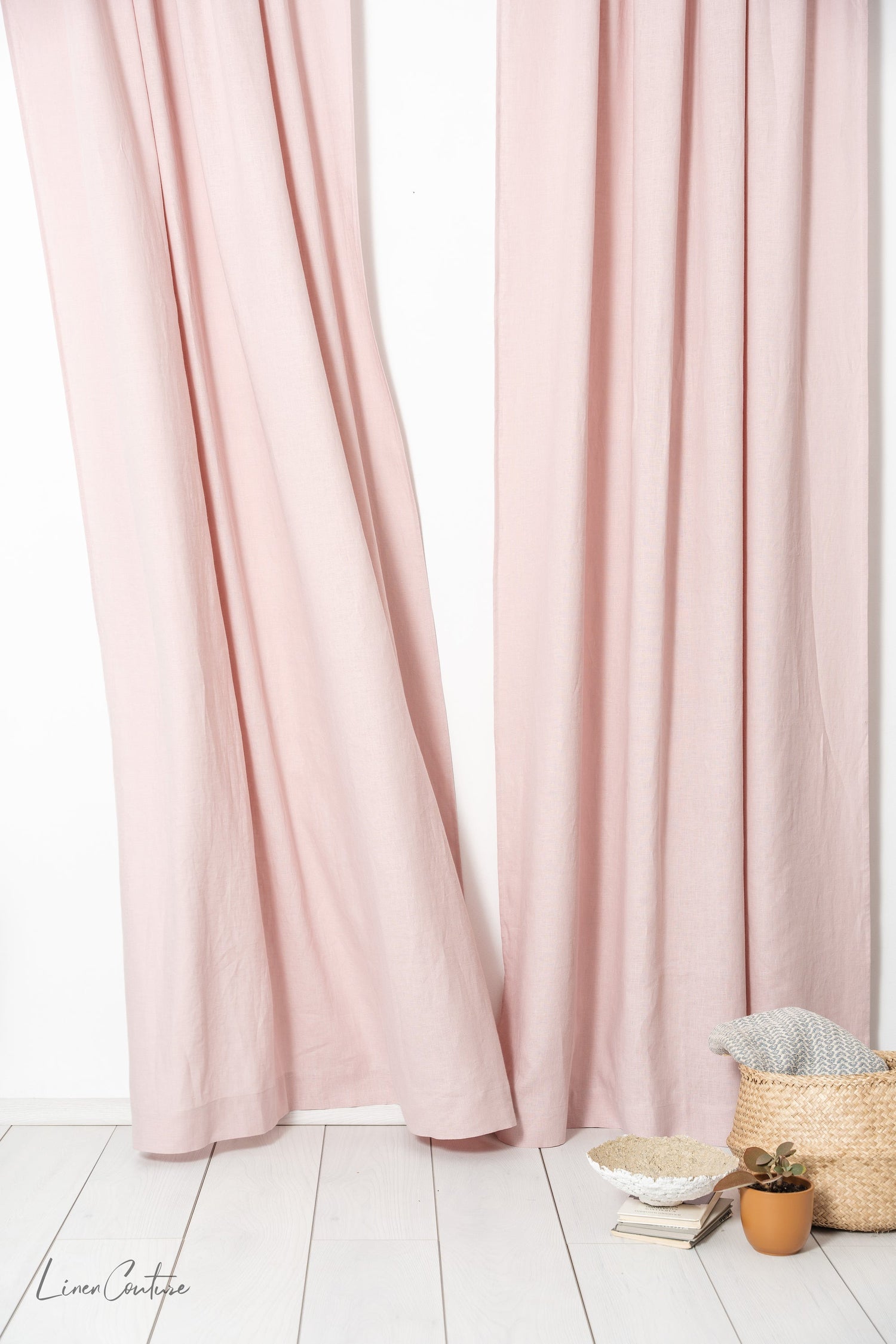 Pale pink linen curtain with tab tops, stylish home decor by Magenta Sugarplum, hanging on a window with natural light.