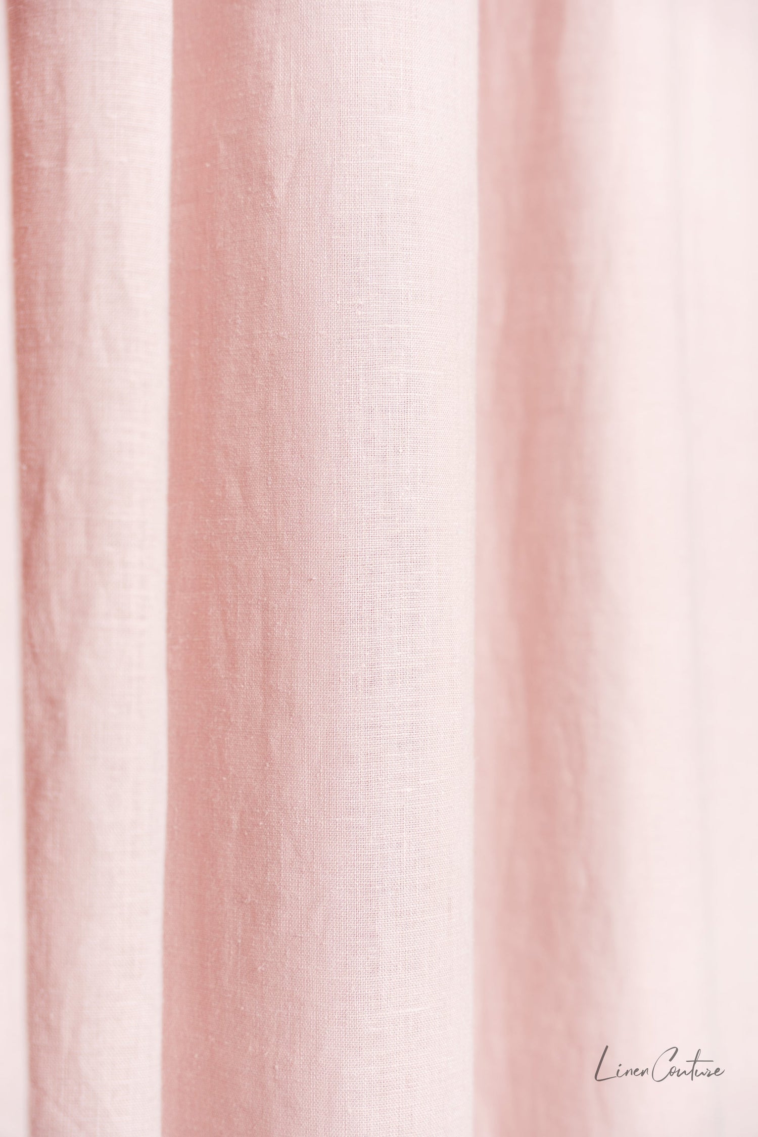 Pale pink linen curtain with tab top design from Magenta Sugarplum, ideal for home decor and window treatments.