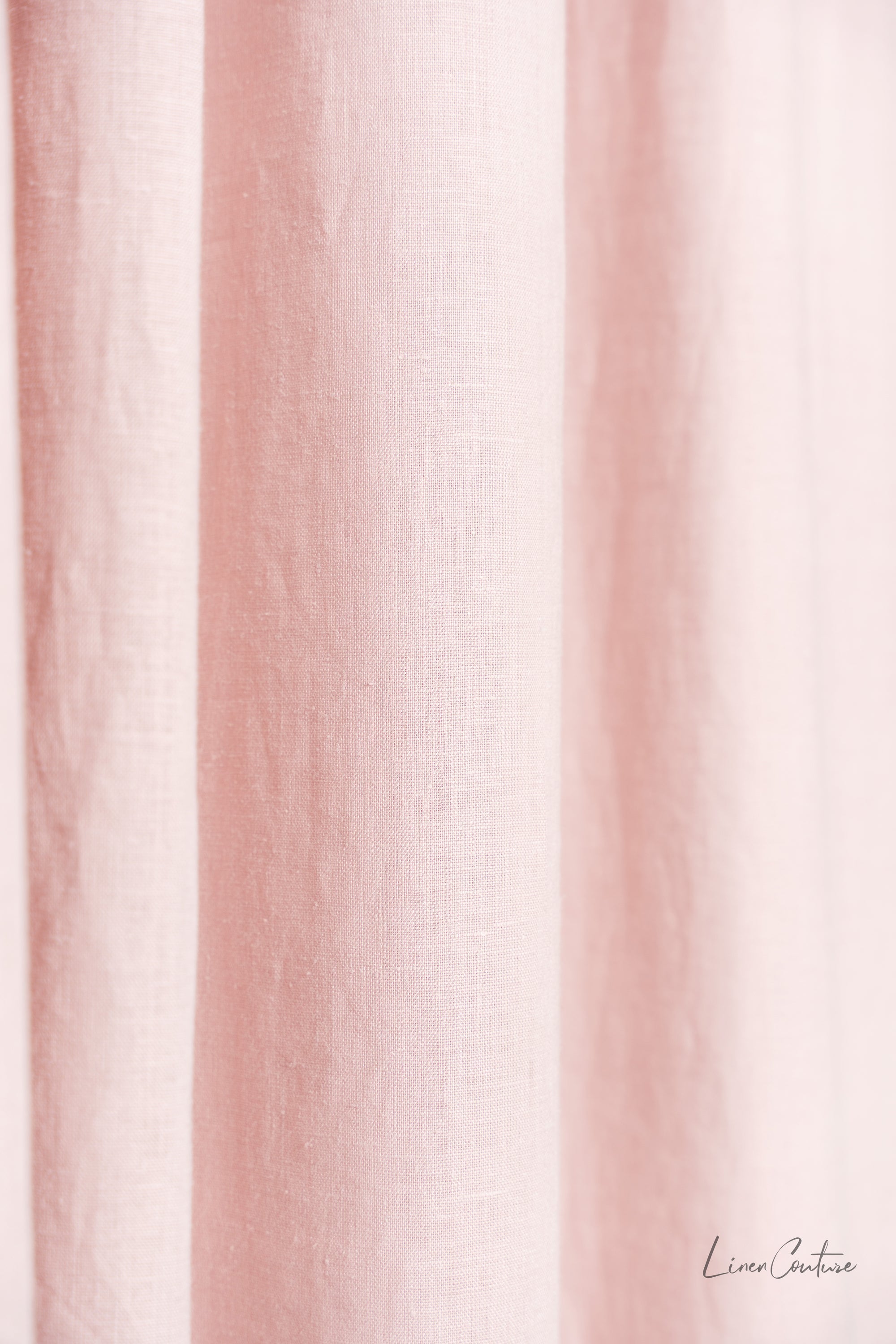 Pale pink linen curtain with tab top design from Magenta Sugarplum, ideal for home decor and window treatments.