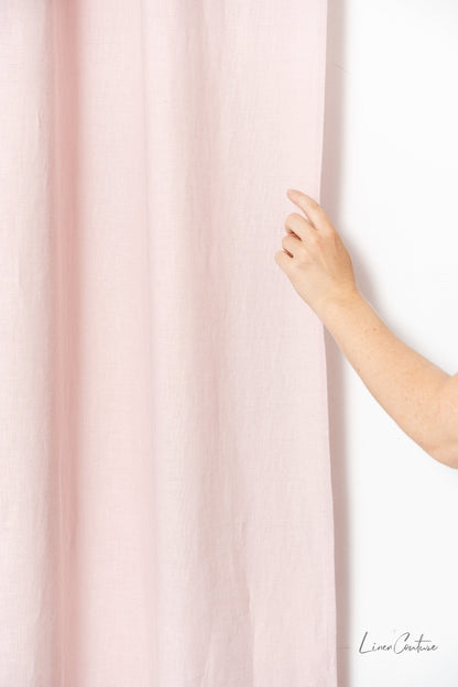 Pale pink linen curtain with tabs, home decor by Magenta Sugarplum, hanging on a window with natural light.