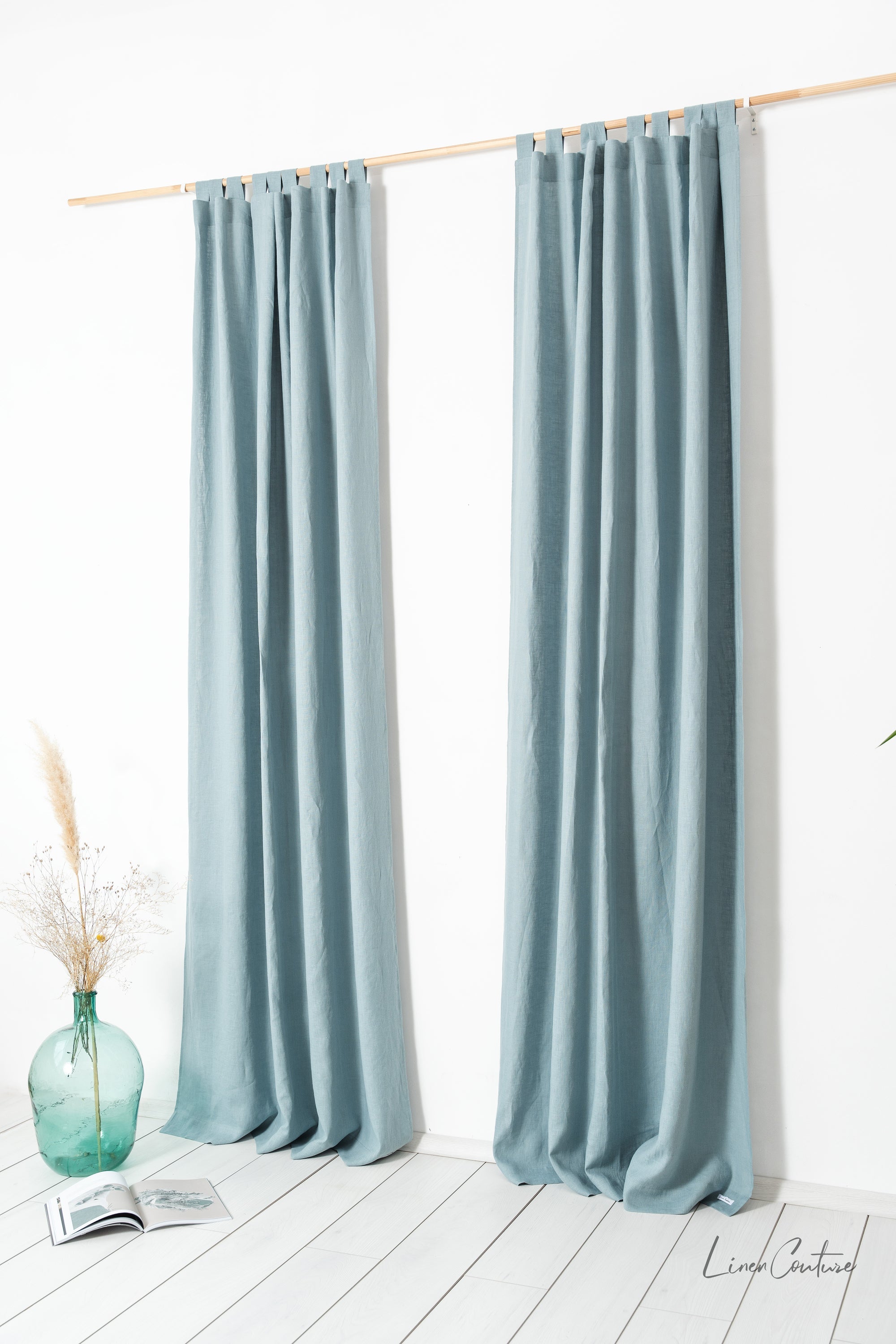 Greyish mint linen curtain with tab top from Magenta Sugarplum, ideal for home decor and window treatment.