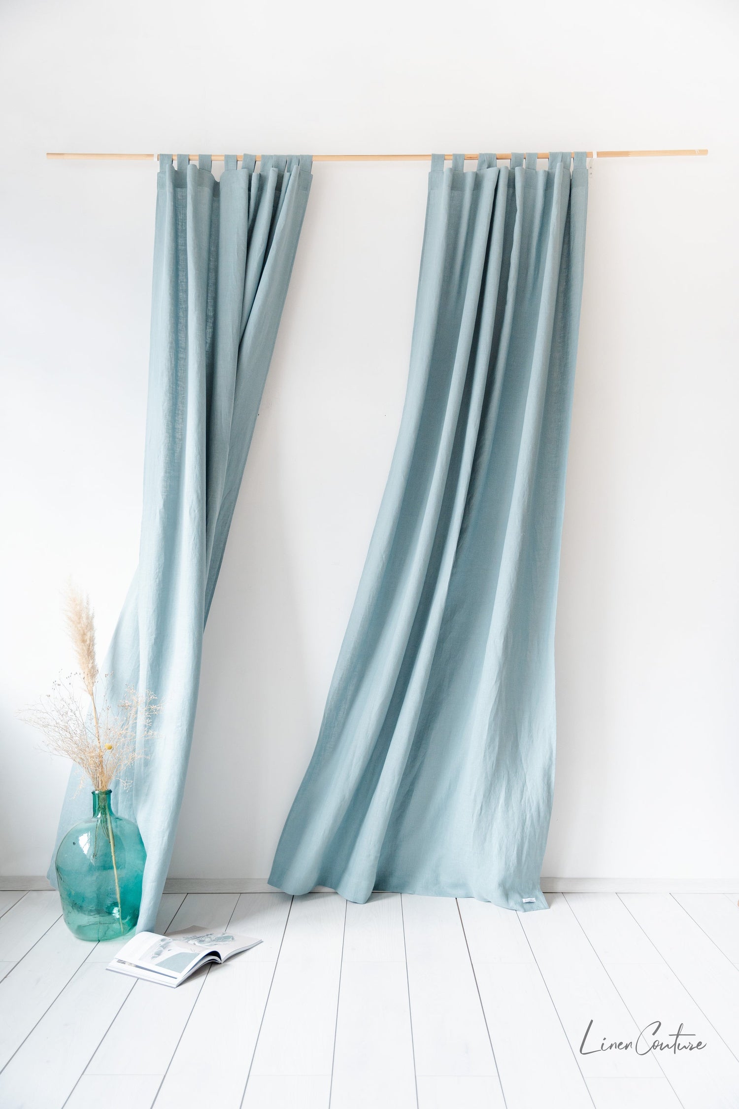 Greyish mint linen curtain with tab tops from Magenta Sugarplum, perfect for home decor, shown hanging on a window.