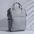 Maroon Chronos quilted diaper baby backpack with multiple compartments and adjustable straps, designed for parent convenience.