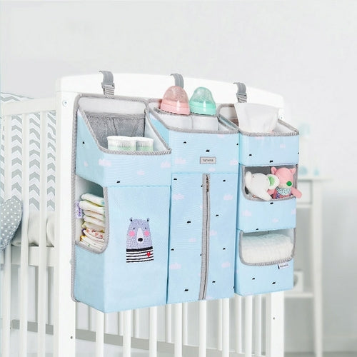 Maroon Chronos baby diaper caddy with dividers for organizing diaper changing essentials in a nursery or on the go.