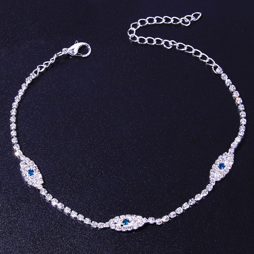 Vintage blue evil eye anklet bracelet by Red Iphigenia featuring crystals, perfect for beachwear and boho style.