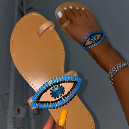 Female rhinestone eyes fashion slippers with round toes and flat soles by Coffee Jasper, perfect for stylish comfort.