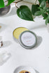 White Smokey organic hair wax for babies, children, and adults, showing a small jar of natural hair styling wax.