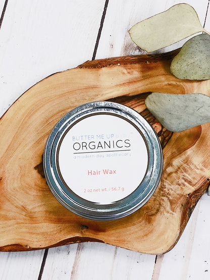 White Smokey organic hair wax for babies, children, and adults, showing the natural wax texture in a jar.